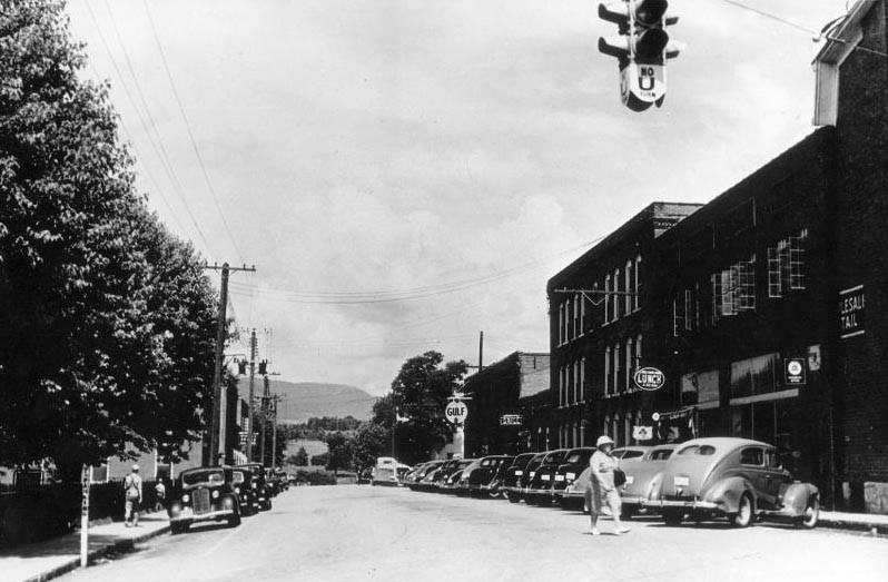 This image offers a view of Wenonah St. in 1940. St. Elizabeth's Hospital building is the tallest building in the image.