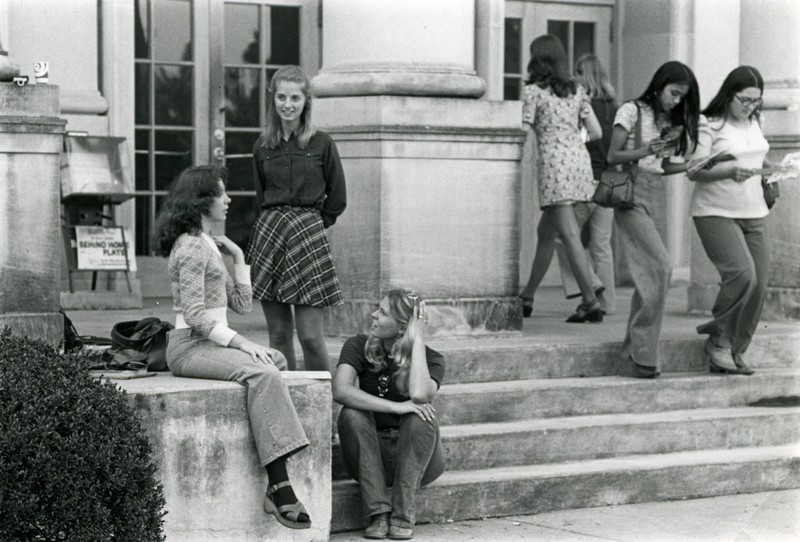 Students talk on the front steps of Morton Hall