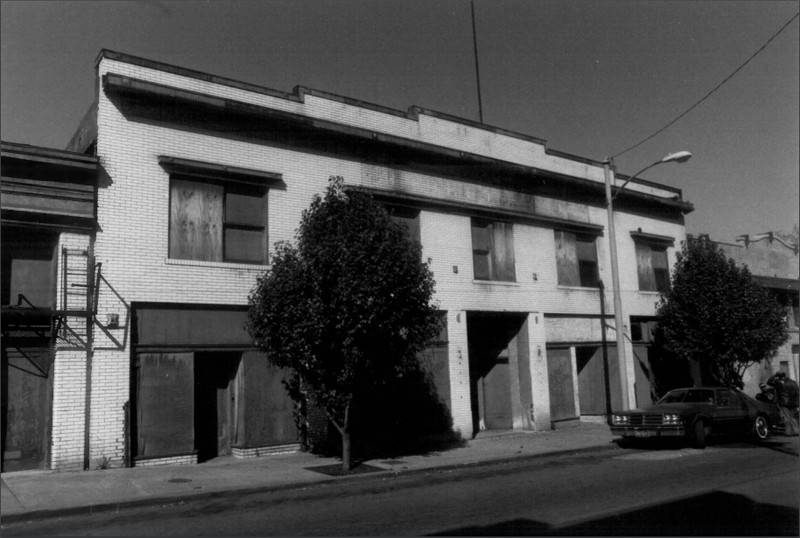 (Description taken from 18th and Vine Historic District National Register of Historic Places Registration Form) The Roberts Building is a two-story brick, rectangular plan, five-bay two-part commercial building. The building's brick exterior is of stretcher bond white glazed brick. The building has four separate storefronts with the primary entrance located in the central bay. This entrance is recessed and has three separate single light glass and wood doors, all of which have been covered with plywood panels. Above each door is a transom bar and rectangular single light transom. The floor surface of this entrance has rectangular marble pavers and a concrete sill with inset metal letters which spell "ROBERTS BUILDING." To the south of the main entrance is a bay containing a large display window. This window has been covered with plywood but rests on an original glazed brick bulkhead. Above the window is a molded wood transom bar and transom which has been covered with plywood panels.