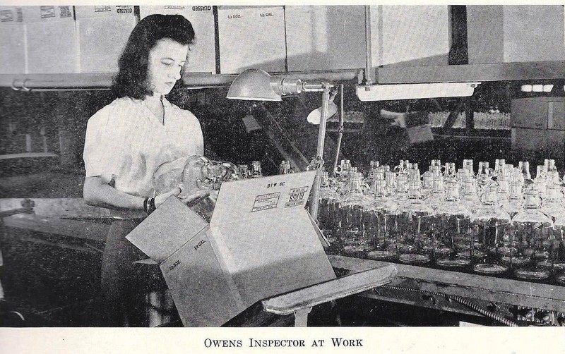 A worker inspects the bottles 