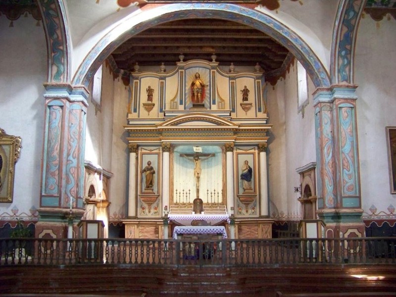 The present-day restored church interior. San Luis Rey features the only surviving cruciform (cross-shaped) structure among the missions, as many original mission churches suffered from repeated earthquakes and had to be rebuilt in the 1800s.