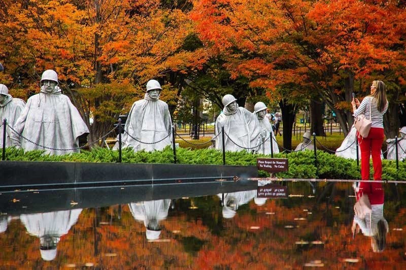 View of soldier statues in the reflection pool to represent the 38th Parallel and thirty-eight months of war.