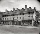 This image shows the New Capital Hotel, which was built from the remains of the St. Charles following a fire in the late 1800s. 