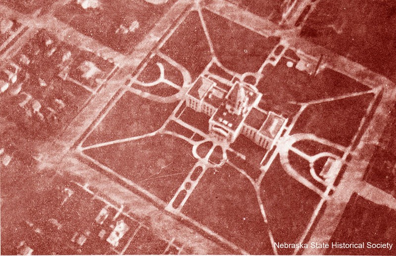 A sepia-colored aerial photograph of the Nebraska State Capitol building in 1915. 