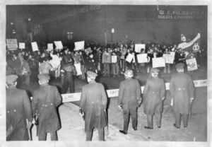 Members of the GAA and GLF confront police following the raid 