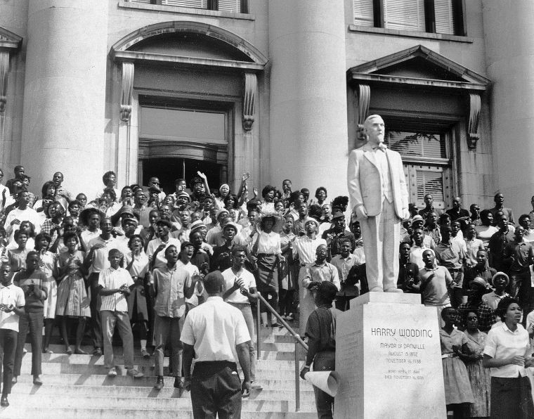 Demonstrators gather on the steps of Danville City Hall. 