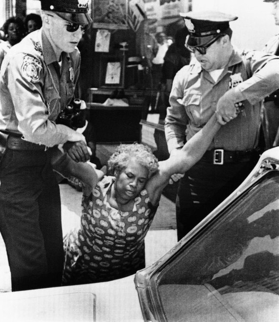 An unidentified woman is carried by Danville police. 