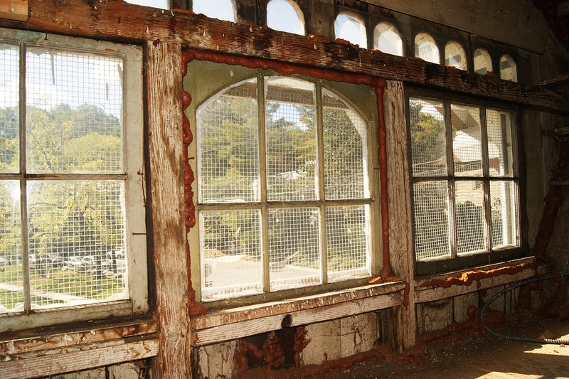 Looking through the grated windows of the former spy station, by Elliot Carter on Atlas Obscura (reproduced under Fair Use)