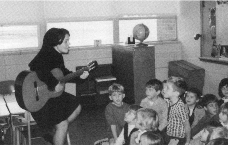 Sister Clare Lawlor sings to her students at Presentation School, 1970s.