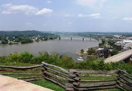 The view of the Ohio River from atop Fort Boreman, which was situated to take advantage of the ridge's commanding heights. In the foreground are recreated breastworks from the Union fort.