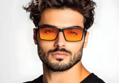 Man with trendy glasses and a well-maintained beard, showing a modern and stylish appearance