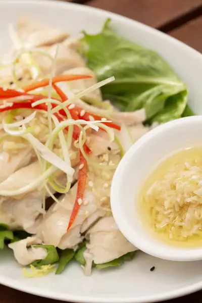 Corn-fed chicken with fresh ginger close-up