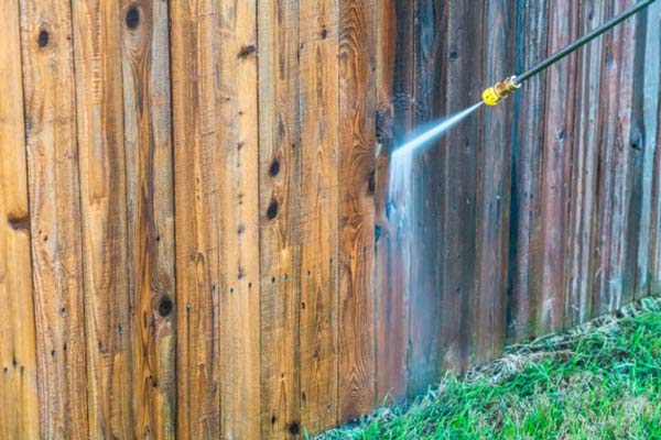 Applying the Cleaning Solution to the Fence