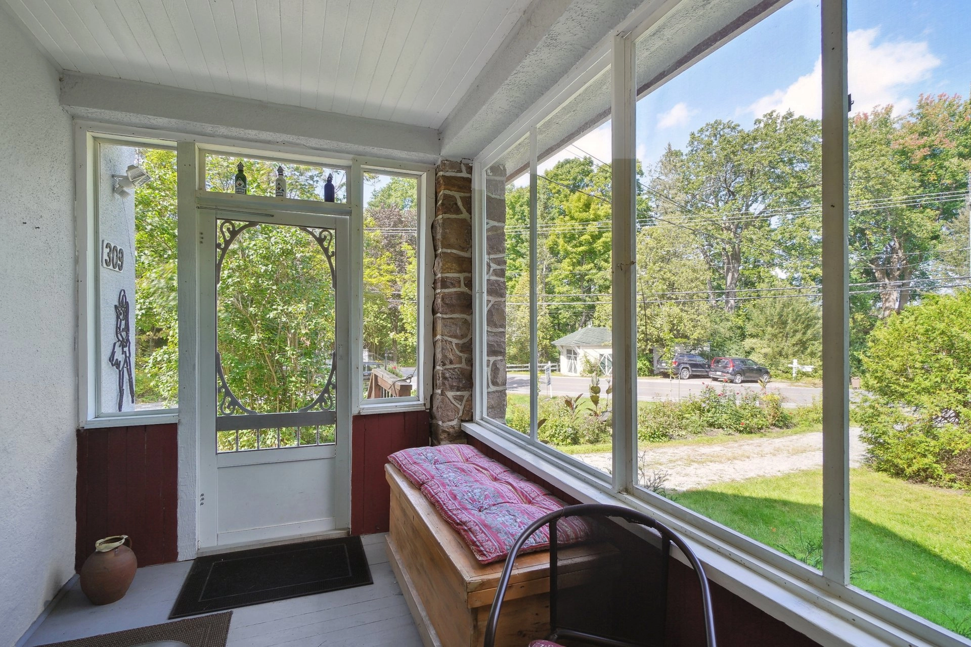 Charming enclosed sunroom with natural light