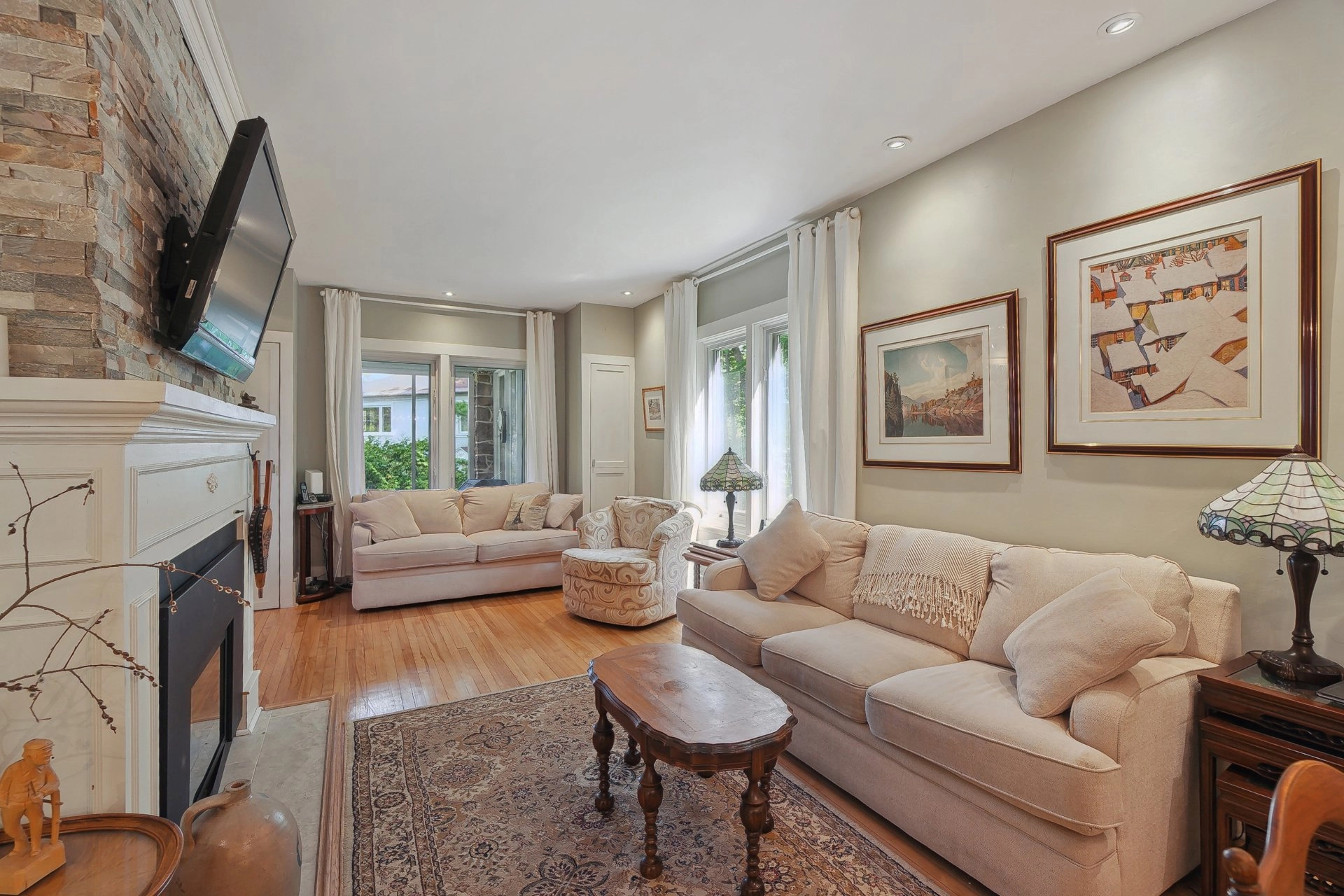 Spacious living room with a stone fireplace