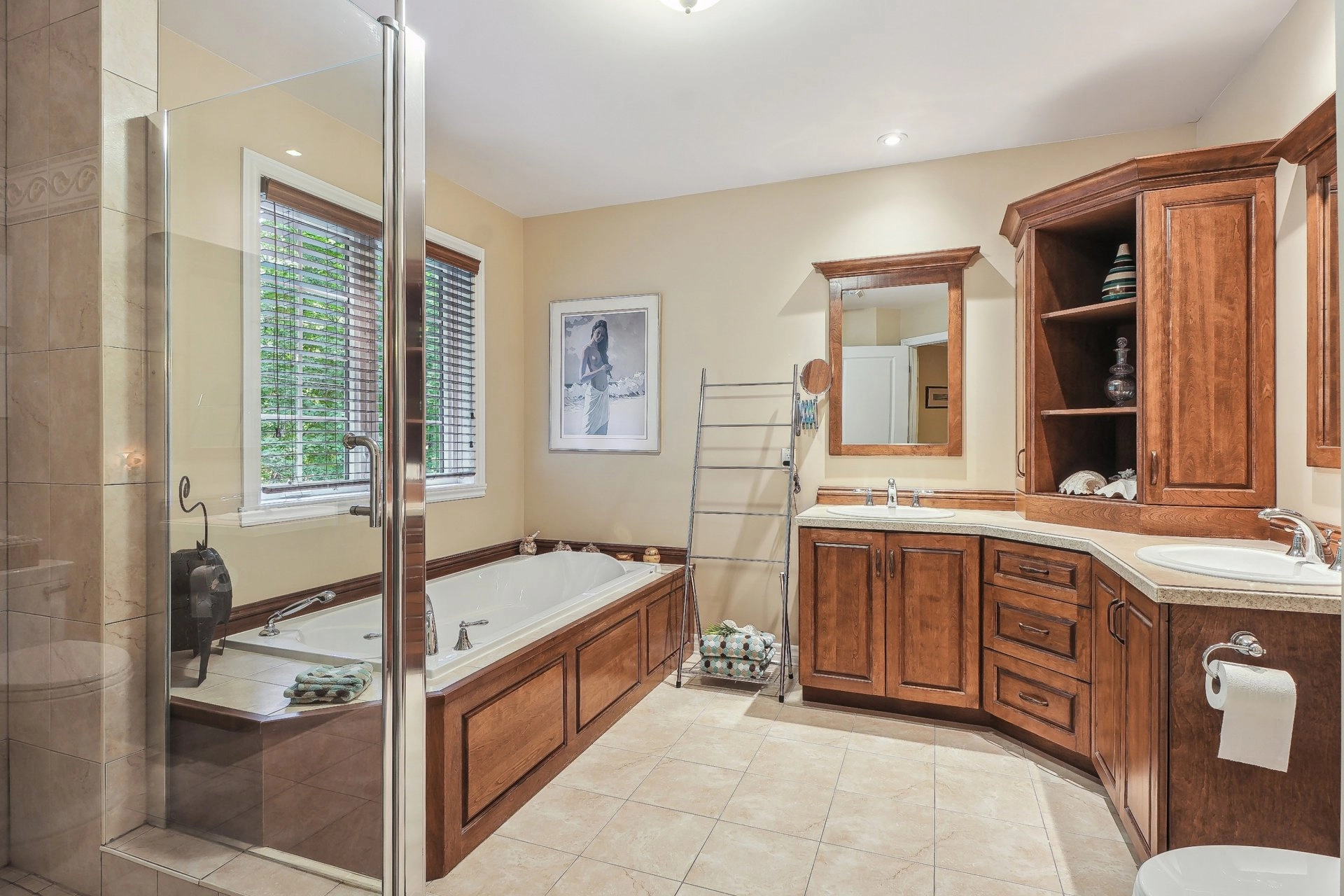 Master bedroom with hardwood floors and abundant natural light