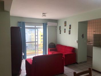 apartamento com sacada frente rua com vista mar 