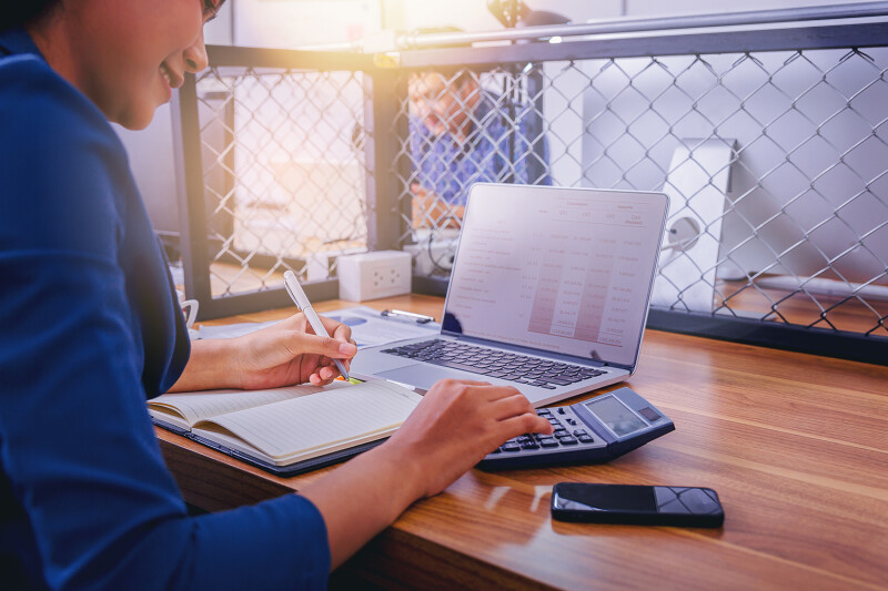 woman-accountant-working-using-calculator-calculate-financial-report-workplace.jpg