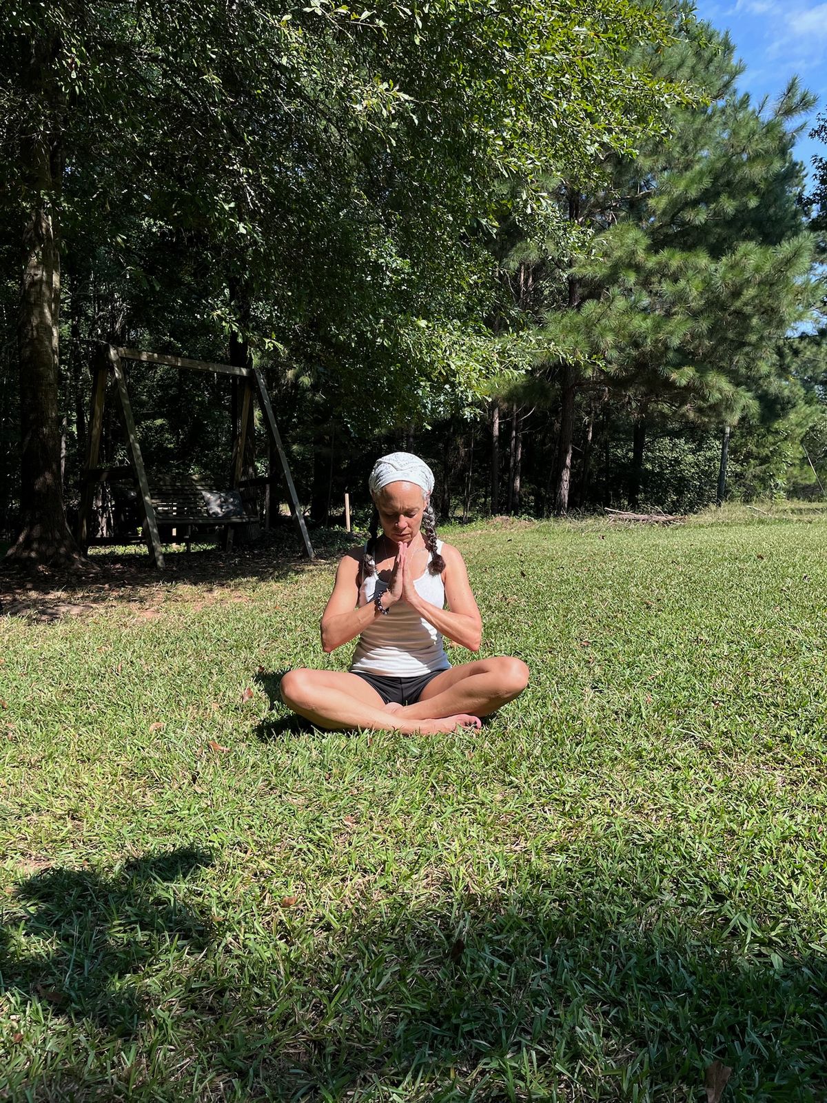 Cozy candlelit meditation setup with soft lighting, crystals, intention cards, and mats arranged in a peaceful circle at Journey Within Wellness