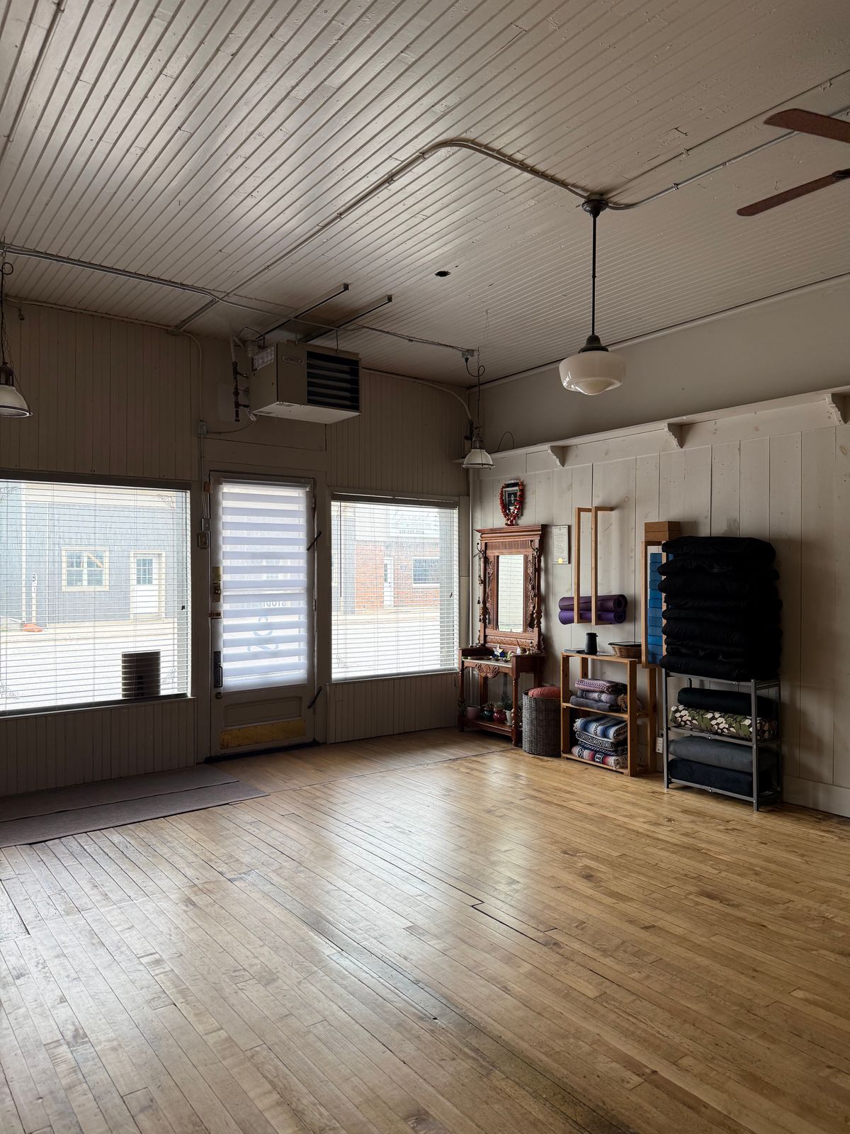 The main studio at Studio 111, an open room with wood floors and natural light.