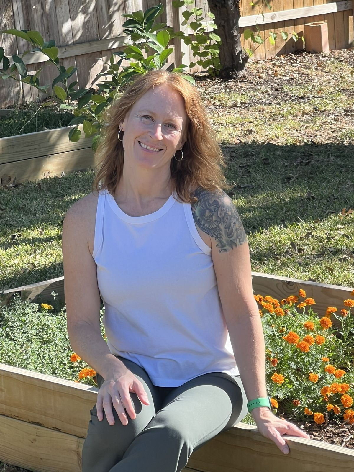 woman sitting in her garden
