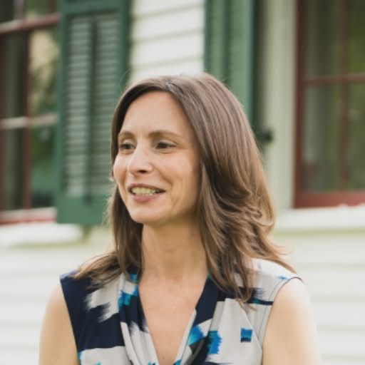 yoga teacher smiling wearing dress