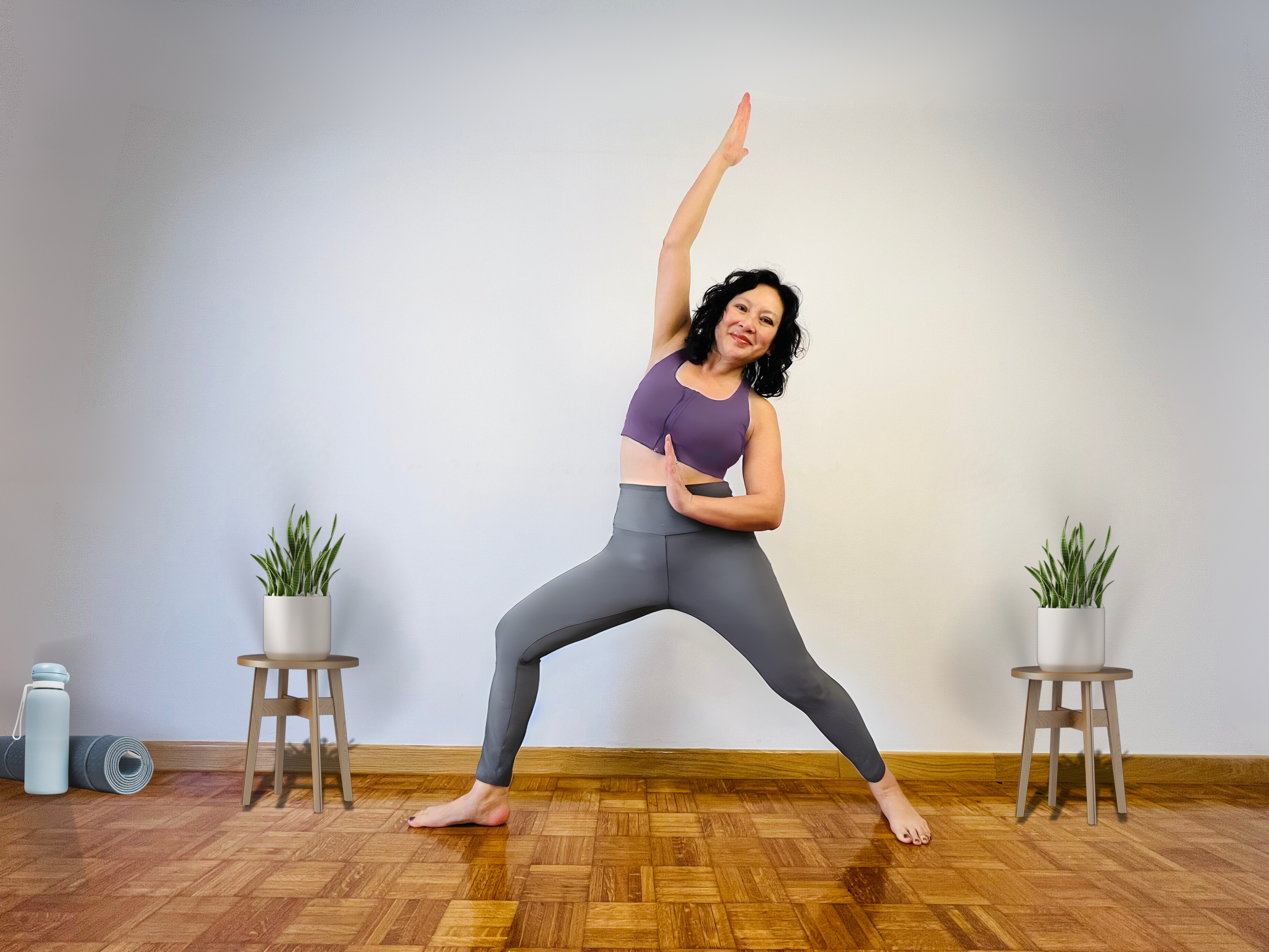 A woman practicing somatic yoga, including somatic exercises and nervous system regulation techniques.