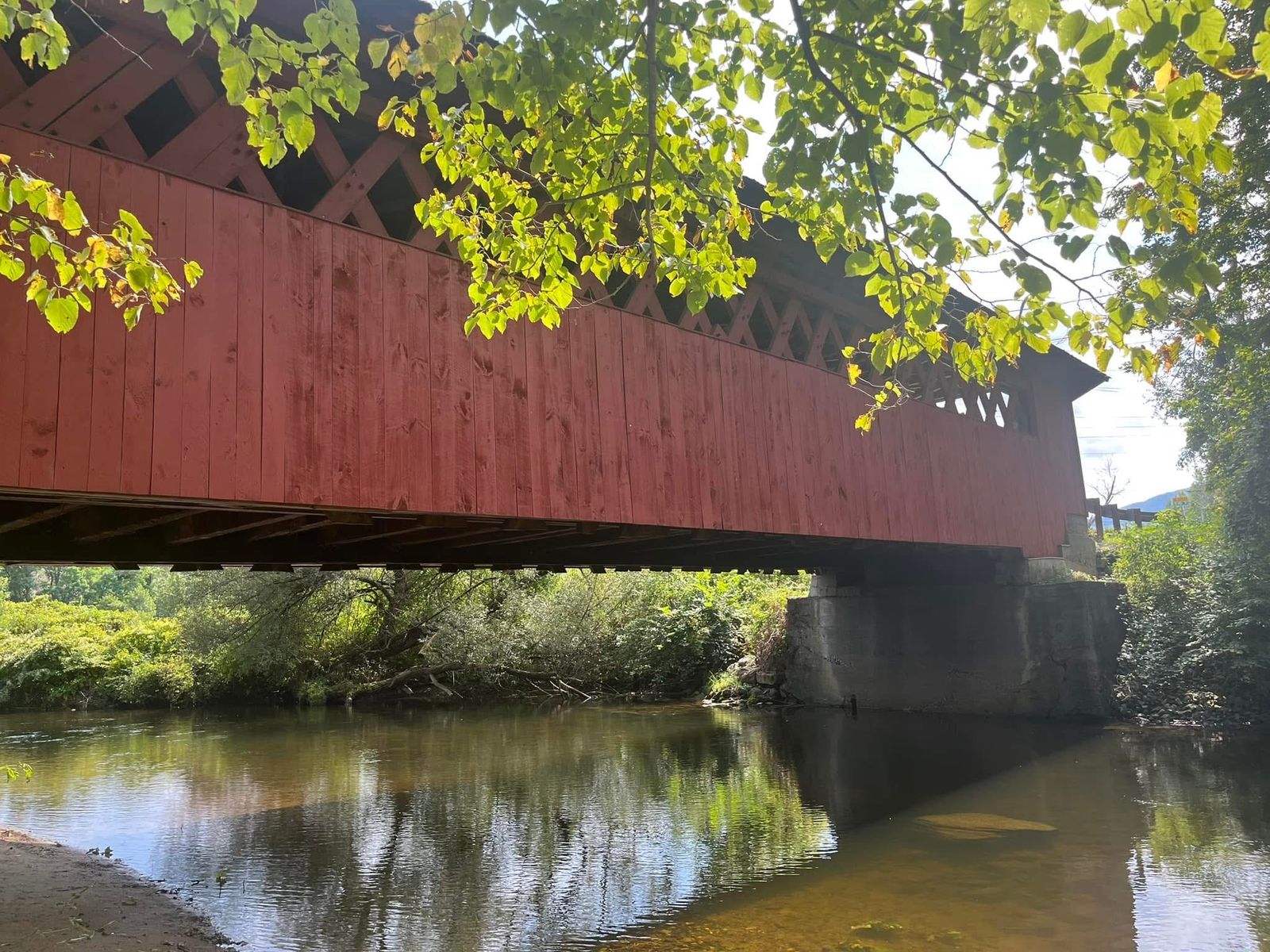 Authors Perspective Sitting Below a Red Covered Bridge Where Intuition Called