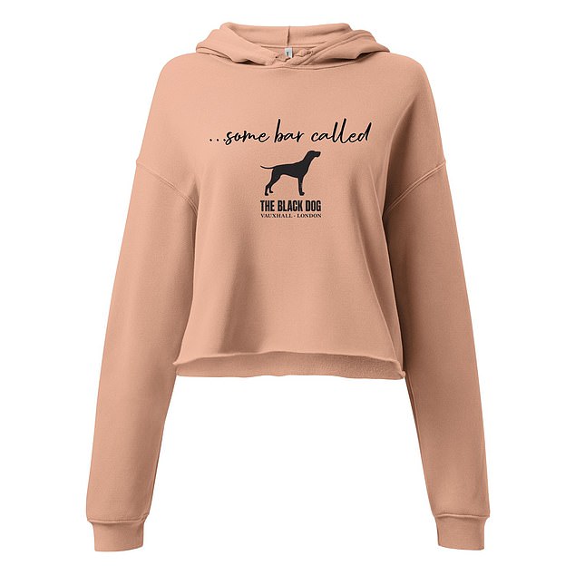 A cropped peach hoodie has the lyric 'come bar called The Black Dog' with the bar's logo and name