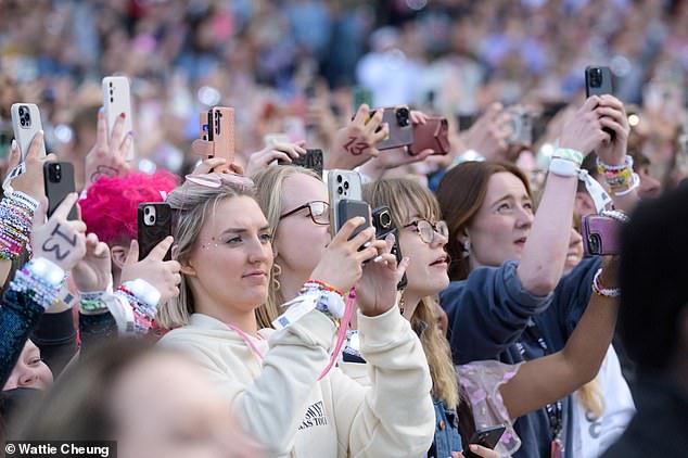 Fans raised their phones in unison as Taylor appeared on stage - capturing the three-and-a-half hour era-spanning show from every angle