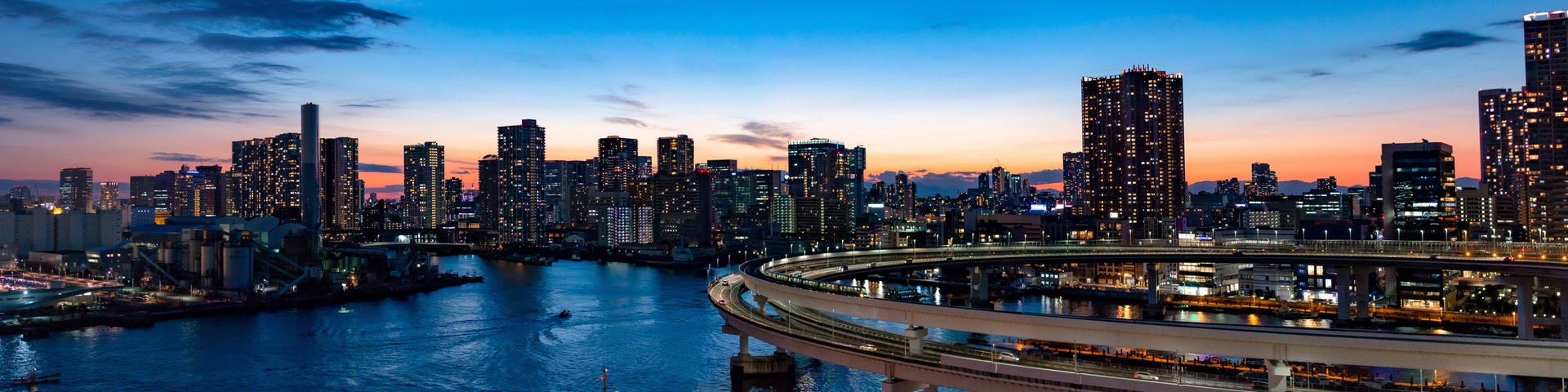 panoramic image of a city at sunset