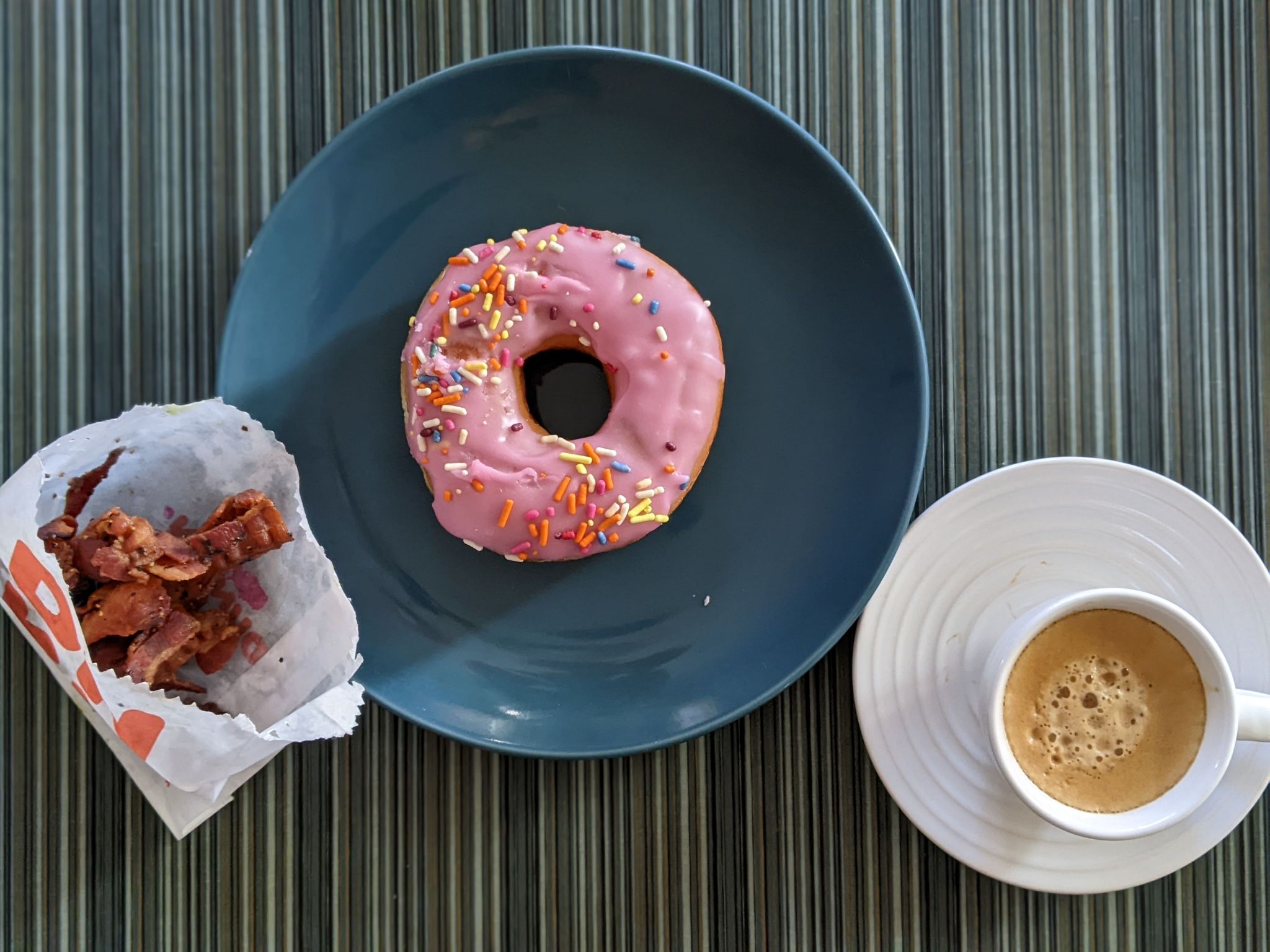 Lots of treats for coffee day: donuts and bacon