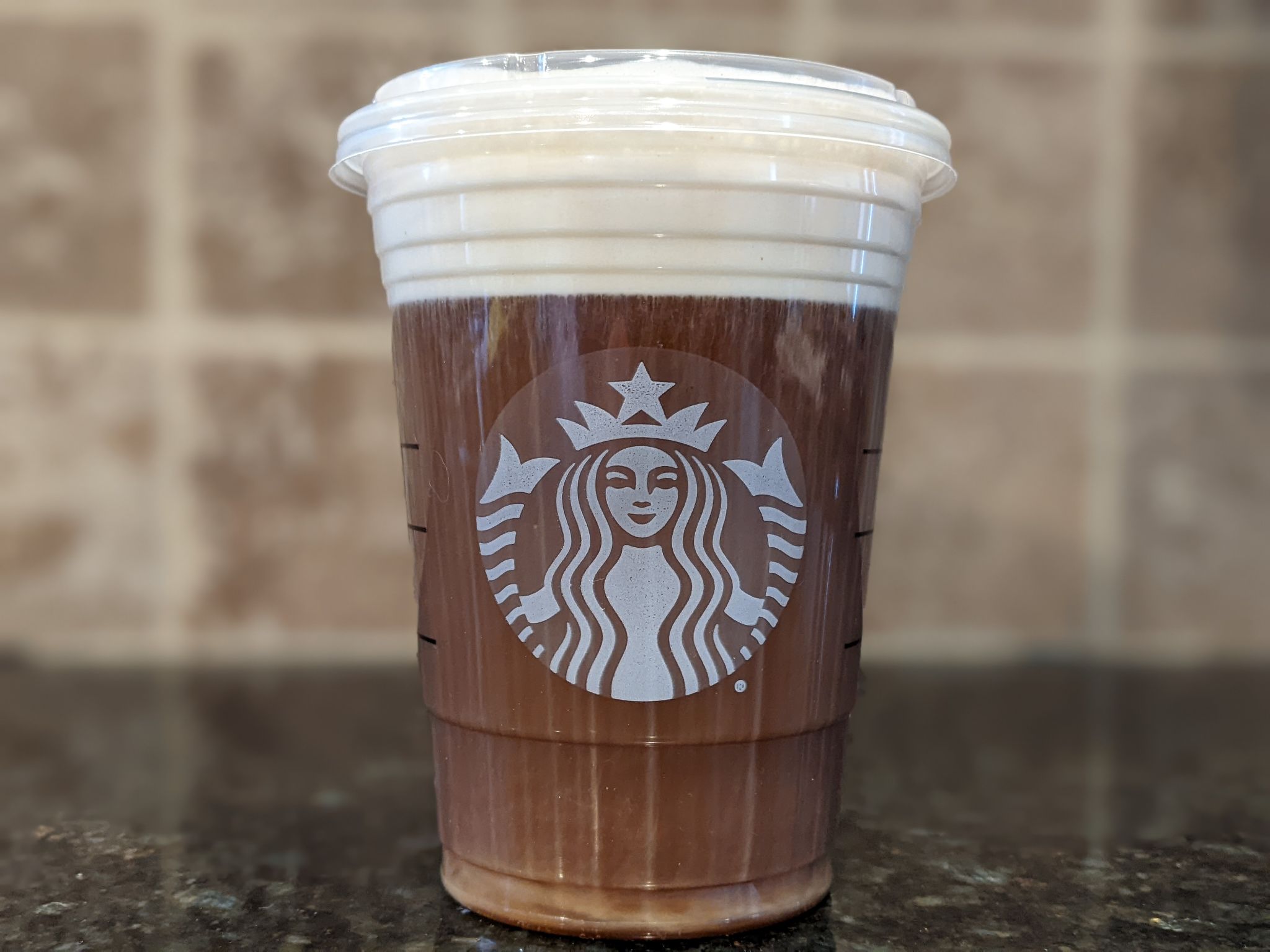 Enjoying a pistachio cold cream with salted brown butter topping on a nitro cold brew
