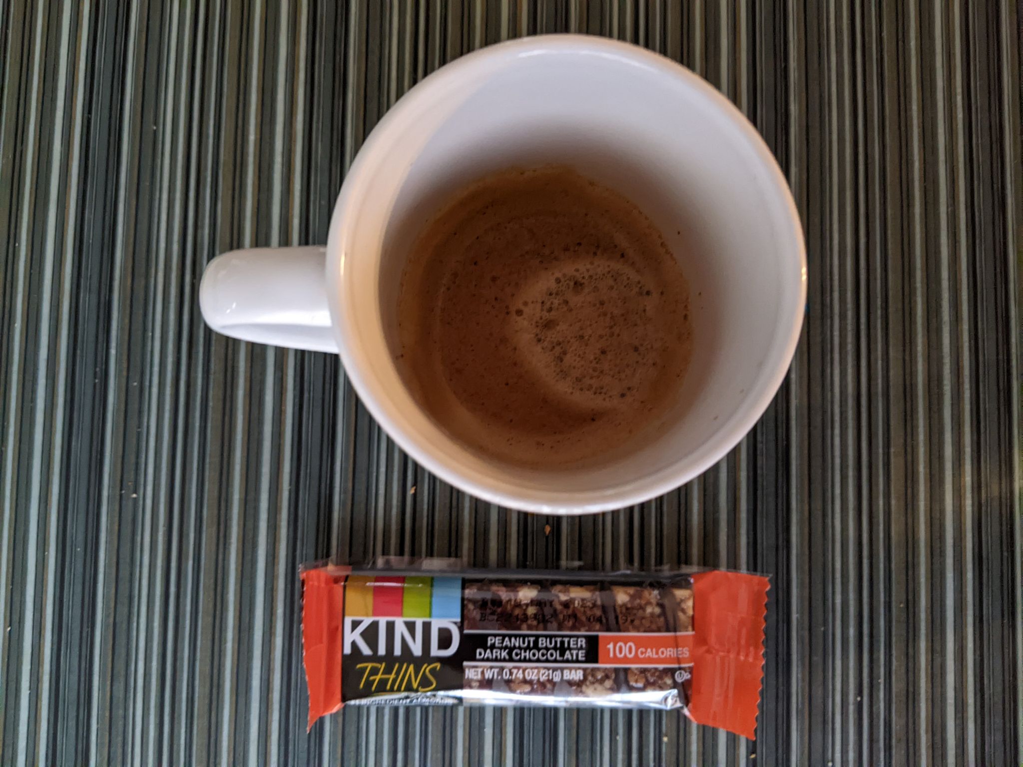 Double espresso and granola bar before another meeting on a sleeting Thursday