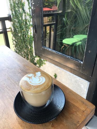 Enjoying my Latte @ Sabre Coffee Shop & Roastery while sitting on the balcony enjoying the cool breeze