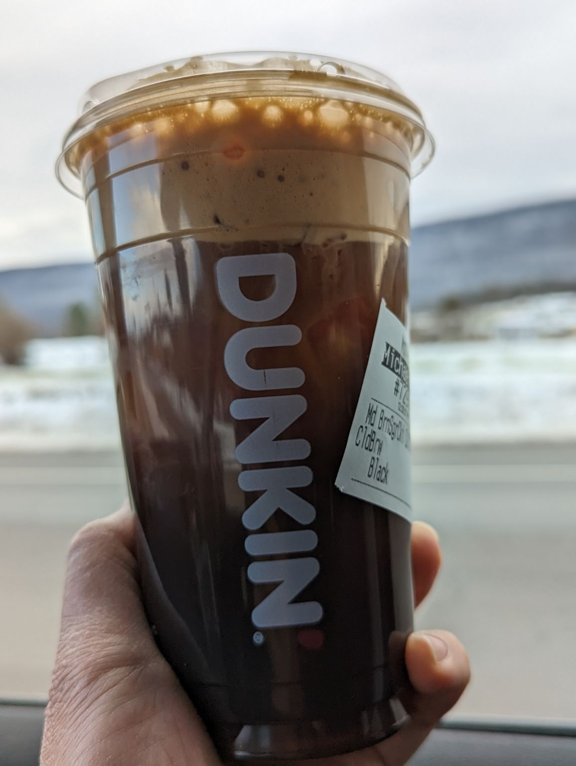 Drinking brown sugar cookie cold brew from Dunkin on a cold Saturday