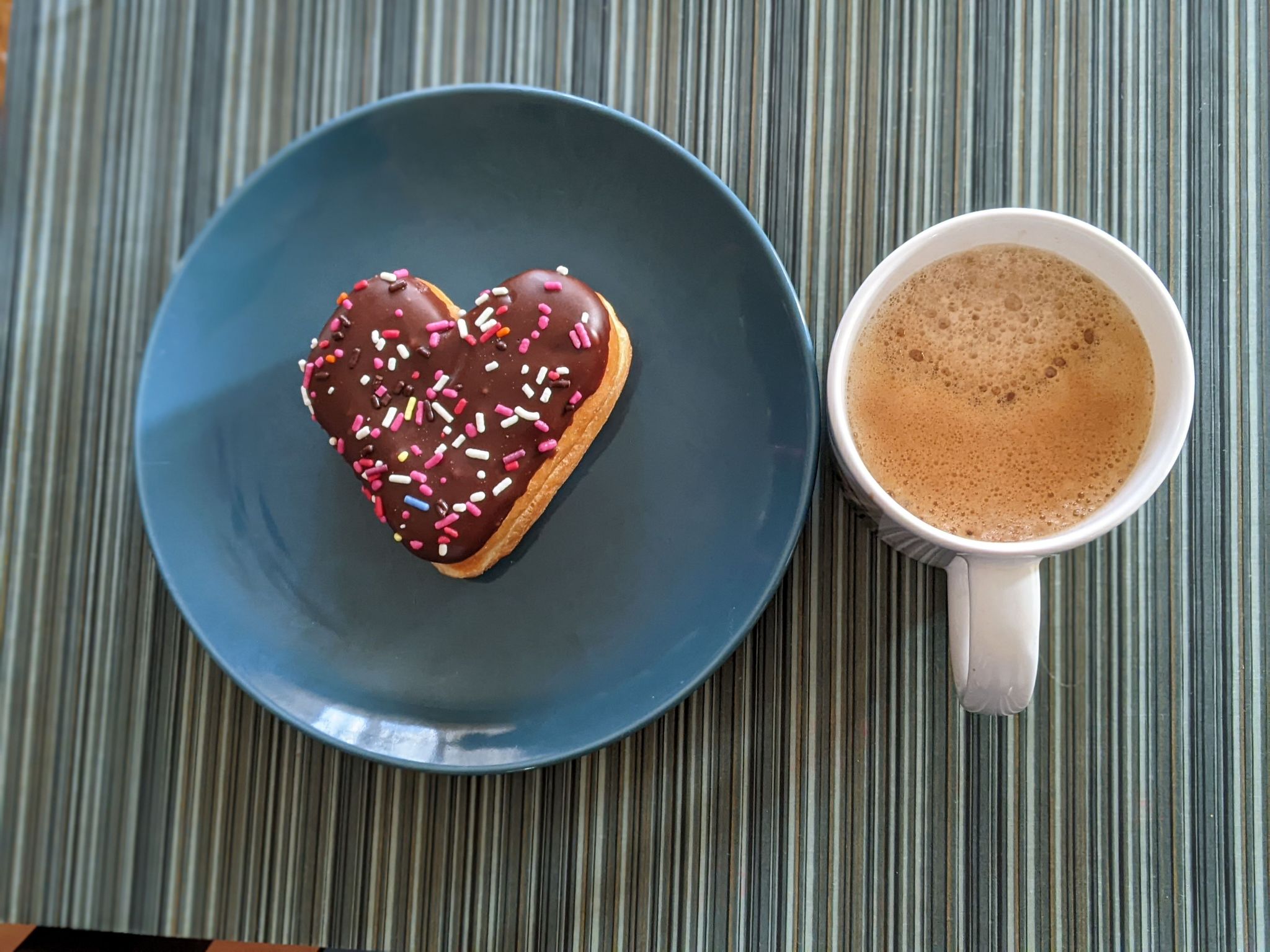 Enjoying a new coffee with the a Dunkin donut.  I prefer a jelly donut, but this will do.