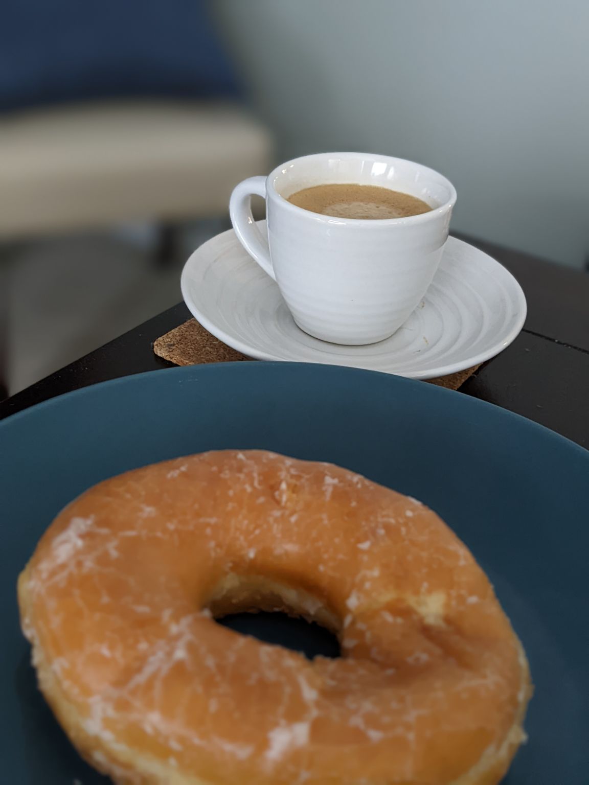 Donuts may appear larger when next to a single espresso
