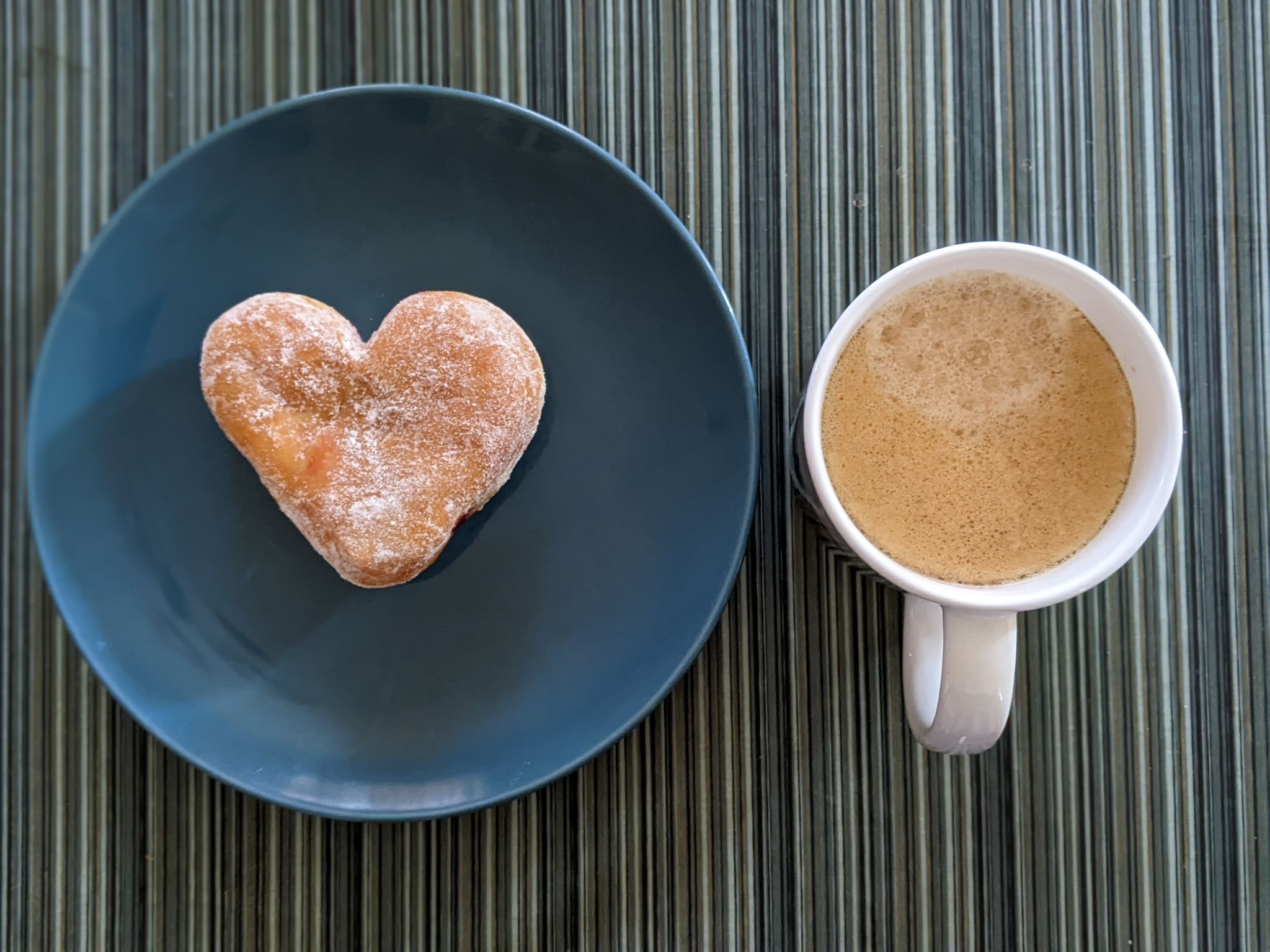 Enjoying a Dunkin donut and coffee during a meeting