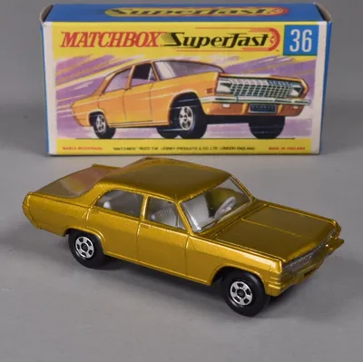A very minty Matchbox SuperFast Opel Diplomat, no.36, in its G type box. This car looks great in gold with a vivid white