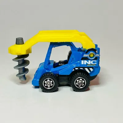 Matchbox INC Construction Drill Digger. Having one of these would have made digging the fence posts easier on our backs.