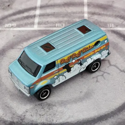 2024 Matchbox No. 14/100 is the '75 Chevy Van.Ruff Ruff Rides Mobile Dog Spa is the livery on the sides of this latest v
