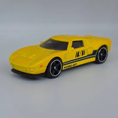 2026 Matchbox No. 93/125 is the 2005 Ford GT. Yellow with number 9 printed on the doors and side panel detailing, this i