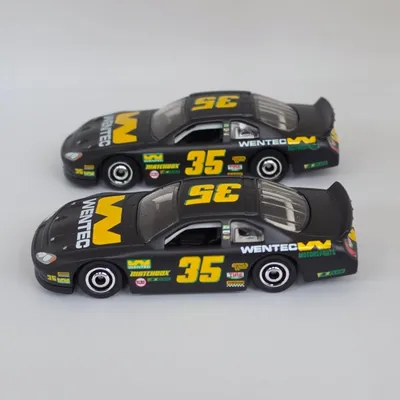 Comparing the pair of Matchbox Chevy Stock Cars.At the front of Photo 1 is the Chevy Stock Car from the Matchbox Movie H