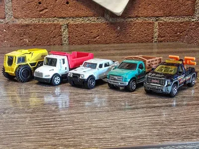 Matchbox Haul: Sherp N1200,  Freightliner M2 106, Lamborghini LM002, Ford F-350 Stake Bed Truck, and 2024 GMC Sierra 350