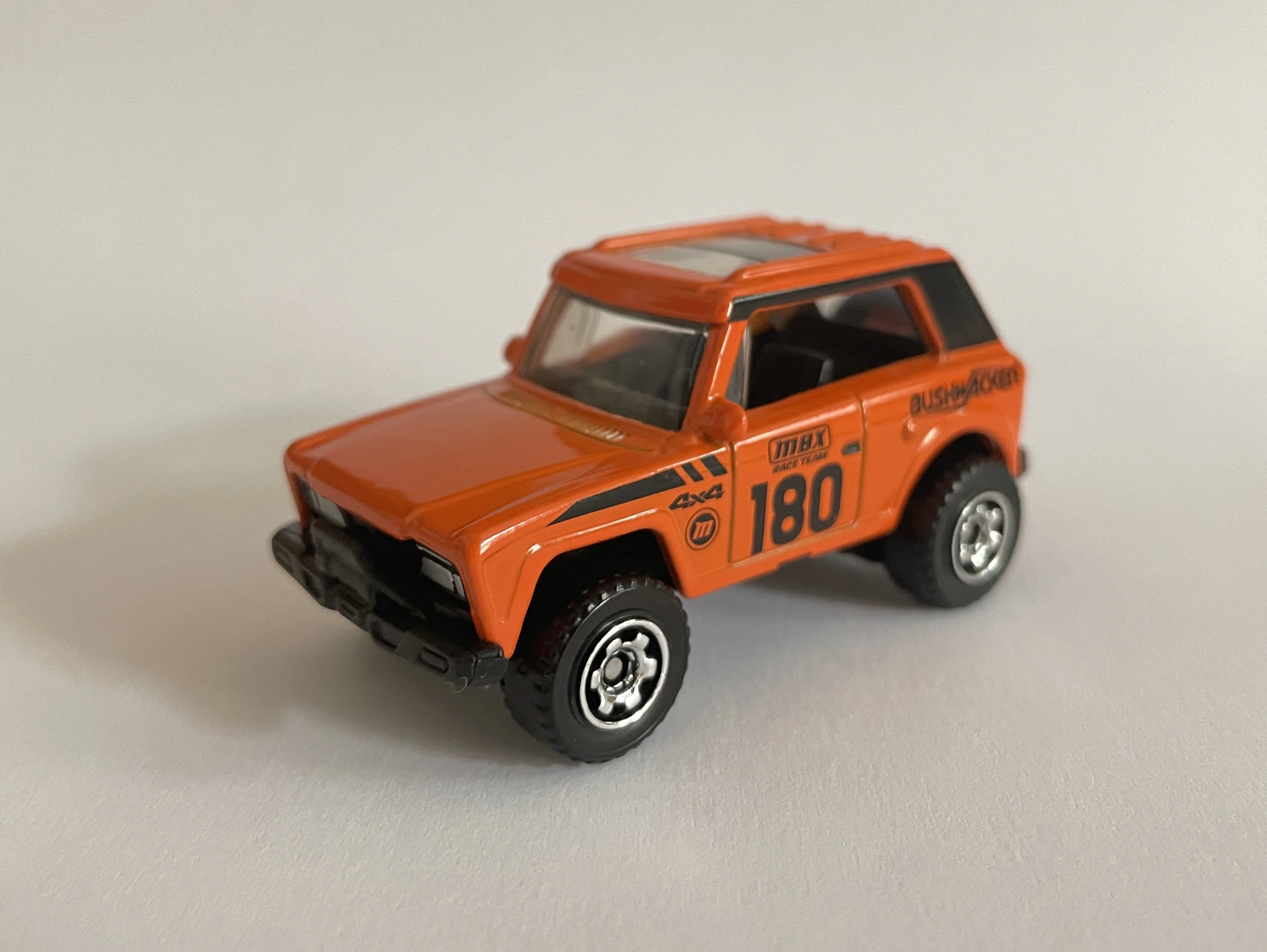 MBX Field Car (Orange, Black Stripes, 180, BUSHWACKER, MBX RACI…)