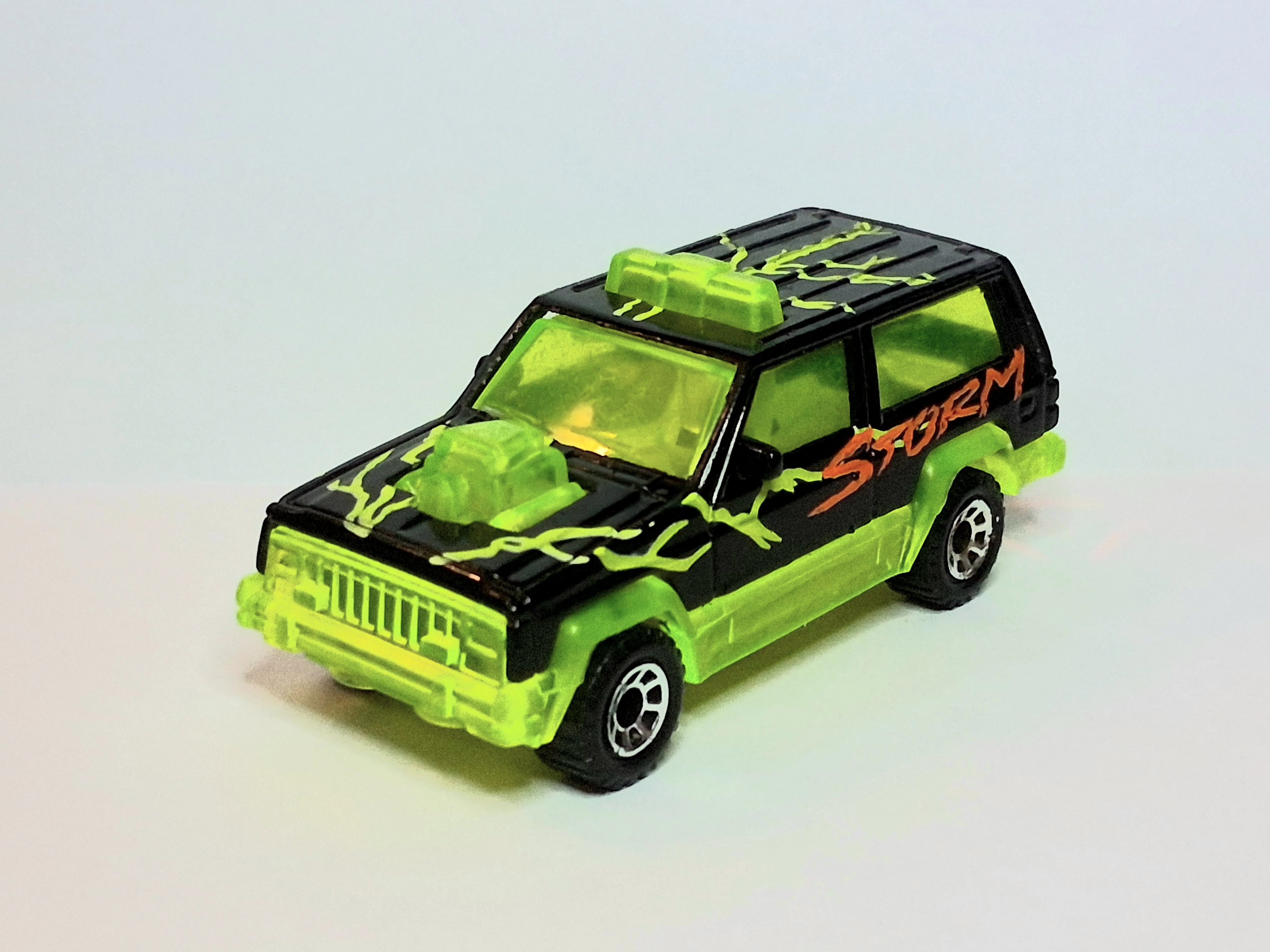 Jeep Cherokee (Black, Yellow lightning bolts, Red "STORM")