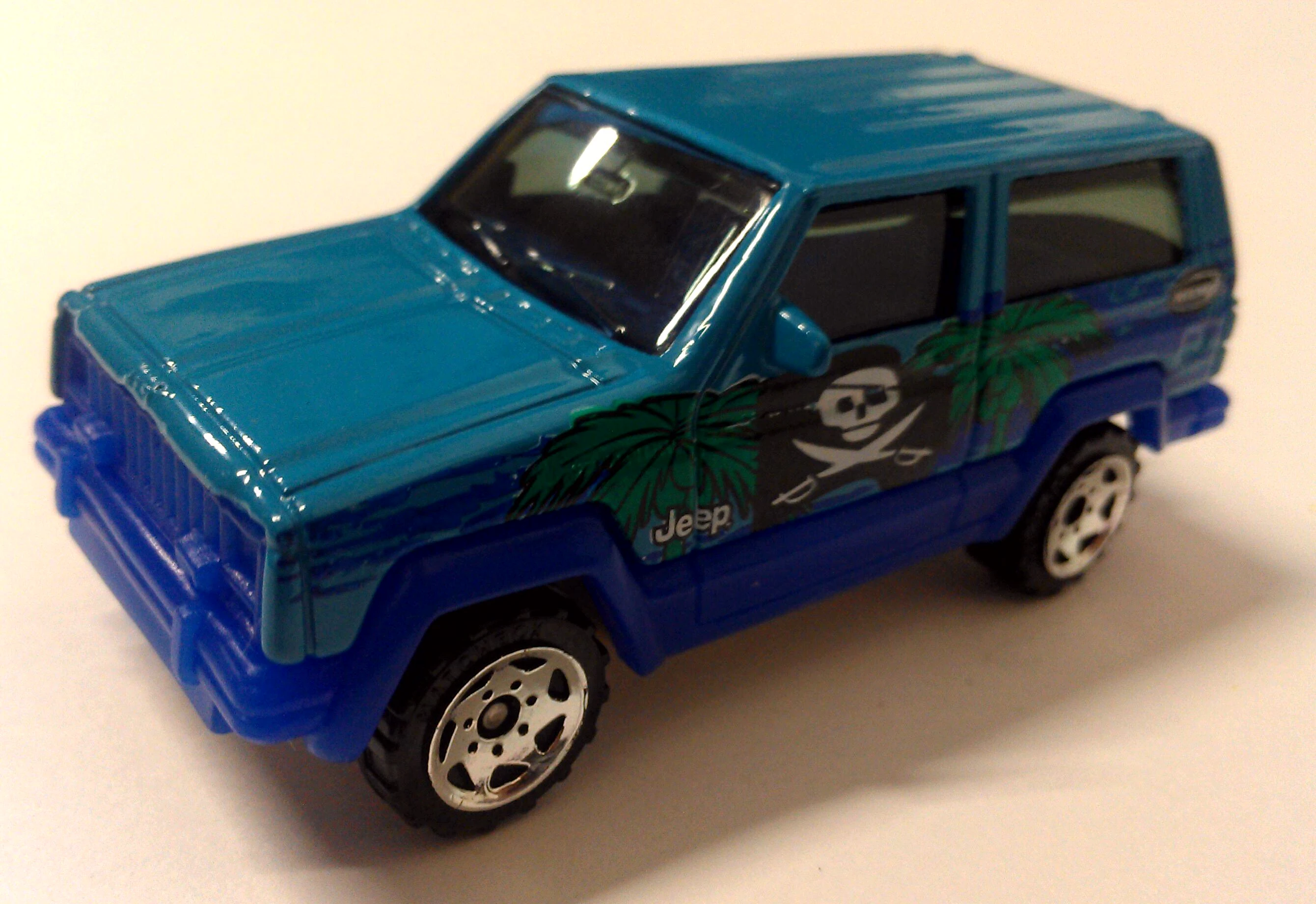 Jeep Cherokee (Turquoise, Palm trees, pirate flag)