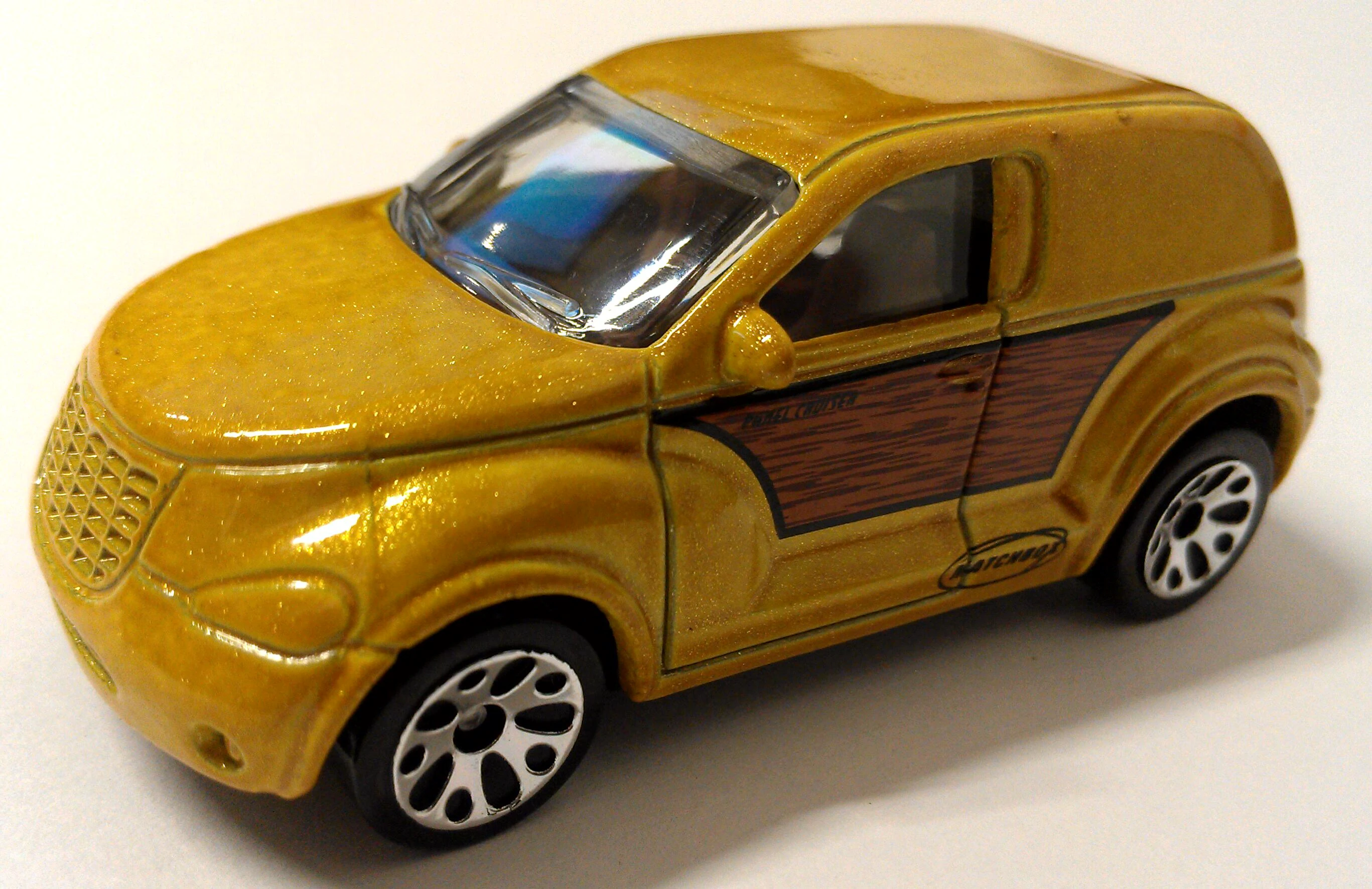 Chrysler Panel Cruiser (Metalflake Gold, Wood panel side section, Black Matchbox…)