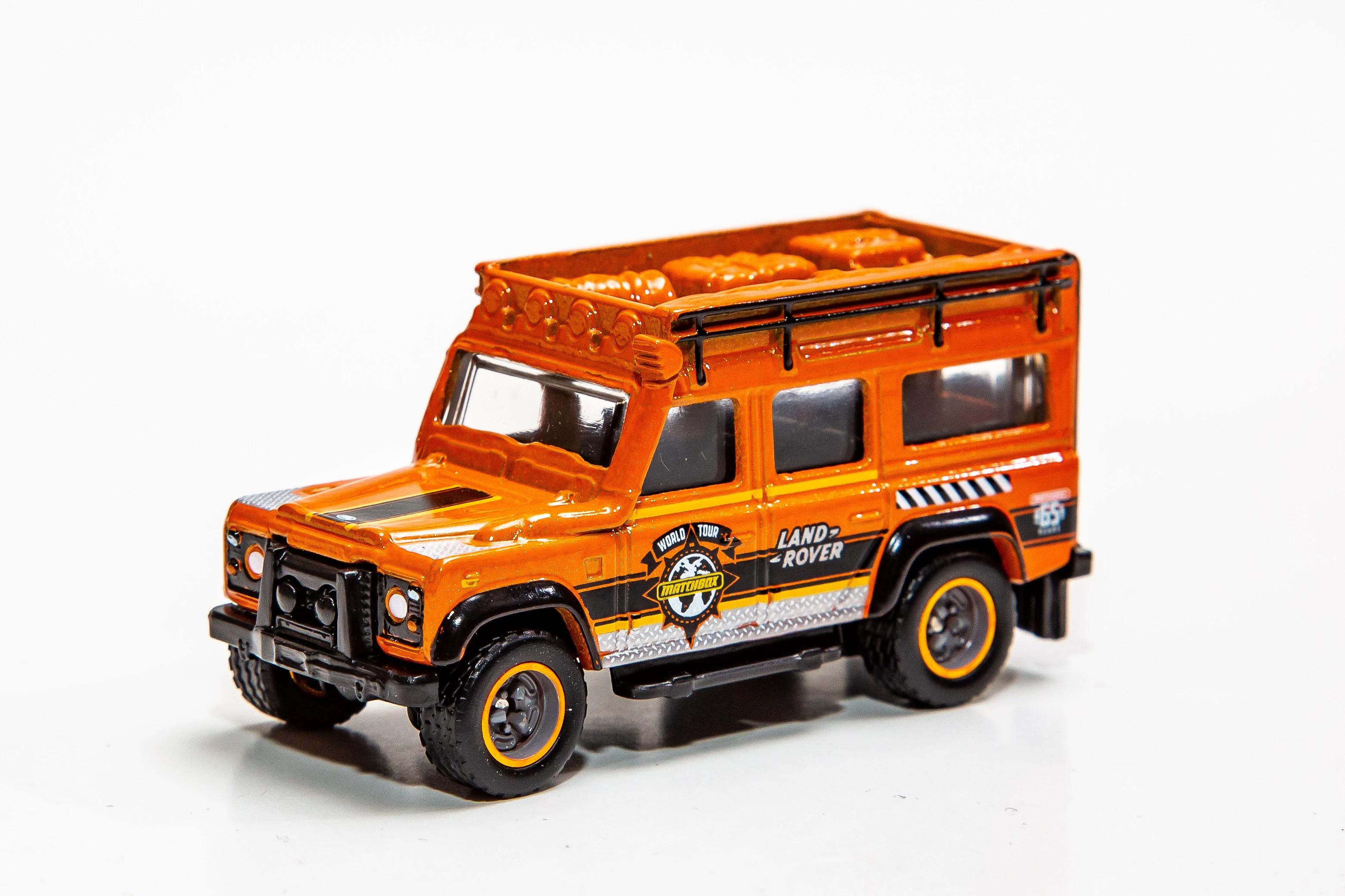 Land Rover Defender 110 (1997) (Orange, Matchbox World Tour logo, Land Rover, 65…)